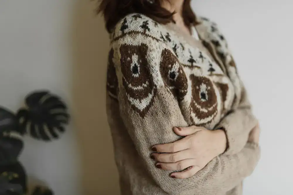 Person wearing a fine lightweight wool cardigan